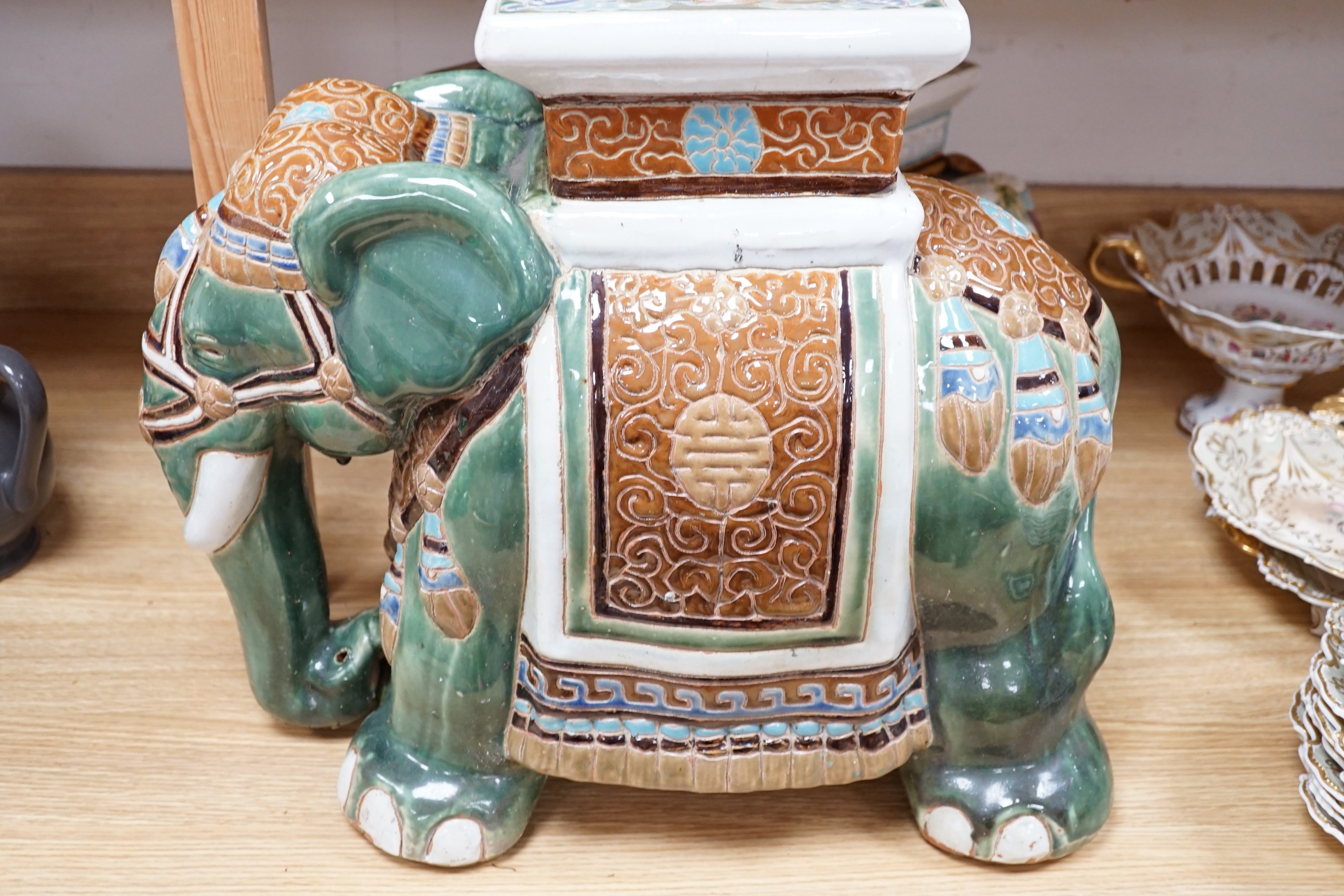 A pair and another elephant and howdah garden seats, largest 43cm